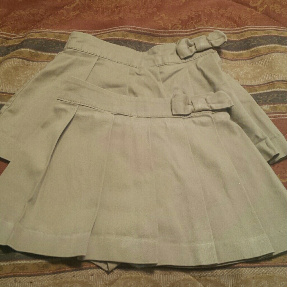 2 uniform skorts and 1 jumper